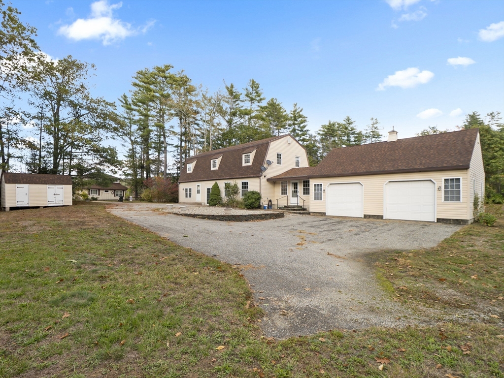 15 South Holden Road Warwick, MA 01378 - Photo 3 of 42 a view of a house with a yard and garage
