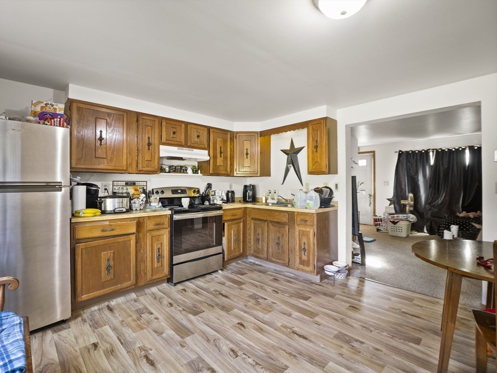15 South Holden Road Warwick, MA 01378 - Photo 32 of 42 a kitchen with sink refrigerator and cabinets