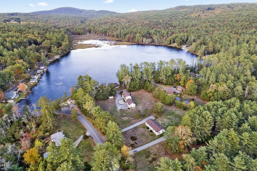 15 South Holden Road Warwick, MA 01378 - Photo 40 of 42 an aerial view of lake residential house with swimming pool and green space
