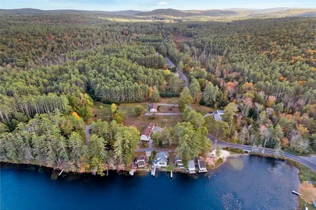 an aerial view of a houses with yard