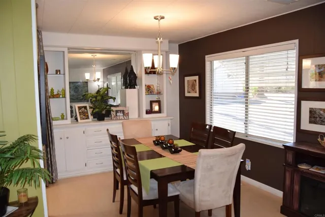 a dining room with furniture and window