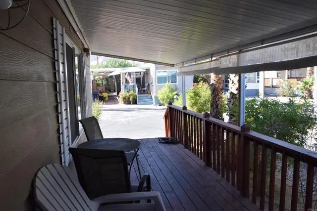 a view of a porch with wooden floor