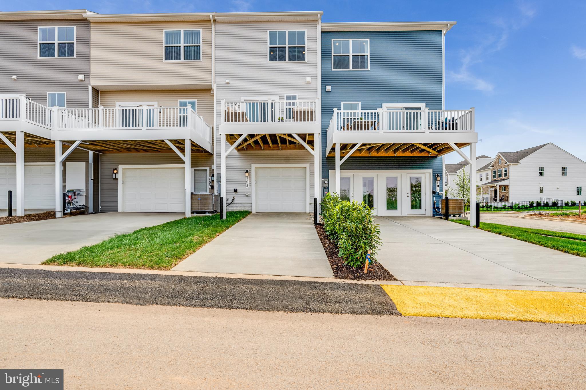 456 18th Avenue Ranson, WV 25438 - Photo 2 of 37 a front view of a house with a garden and plants