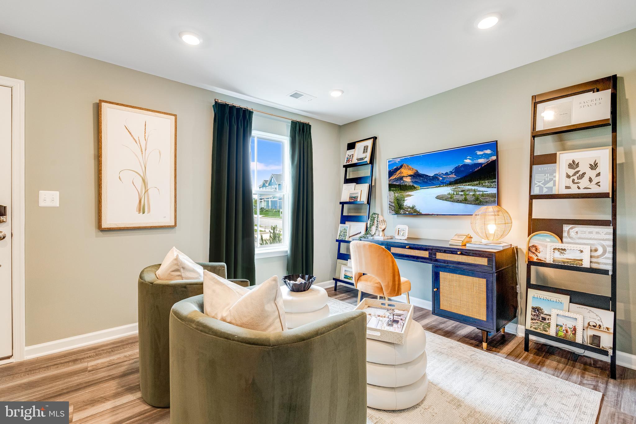 456 18th Avenue Ranson, WV 25438 - Photo 30 of 37 a living room with furniture a flat screen tv and a fireplace