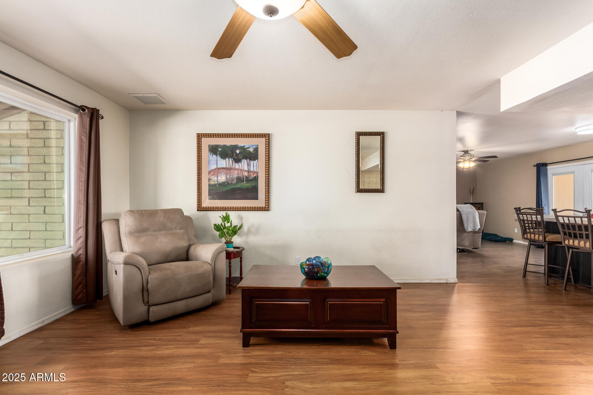 3341 West Pershing Avenue Phoenix, AZ 85029 - Photo 11 of 36 a living room with furniture and wooden floor