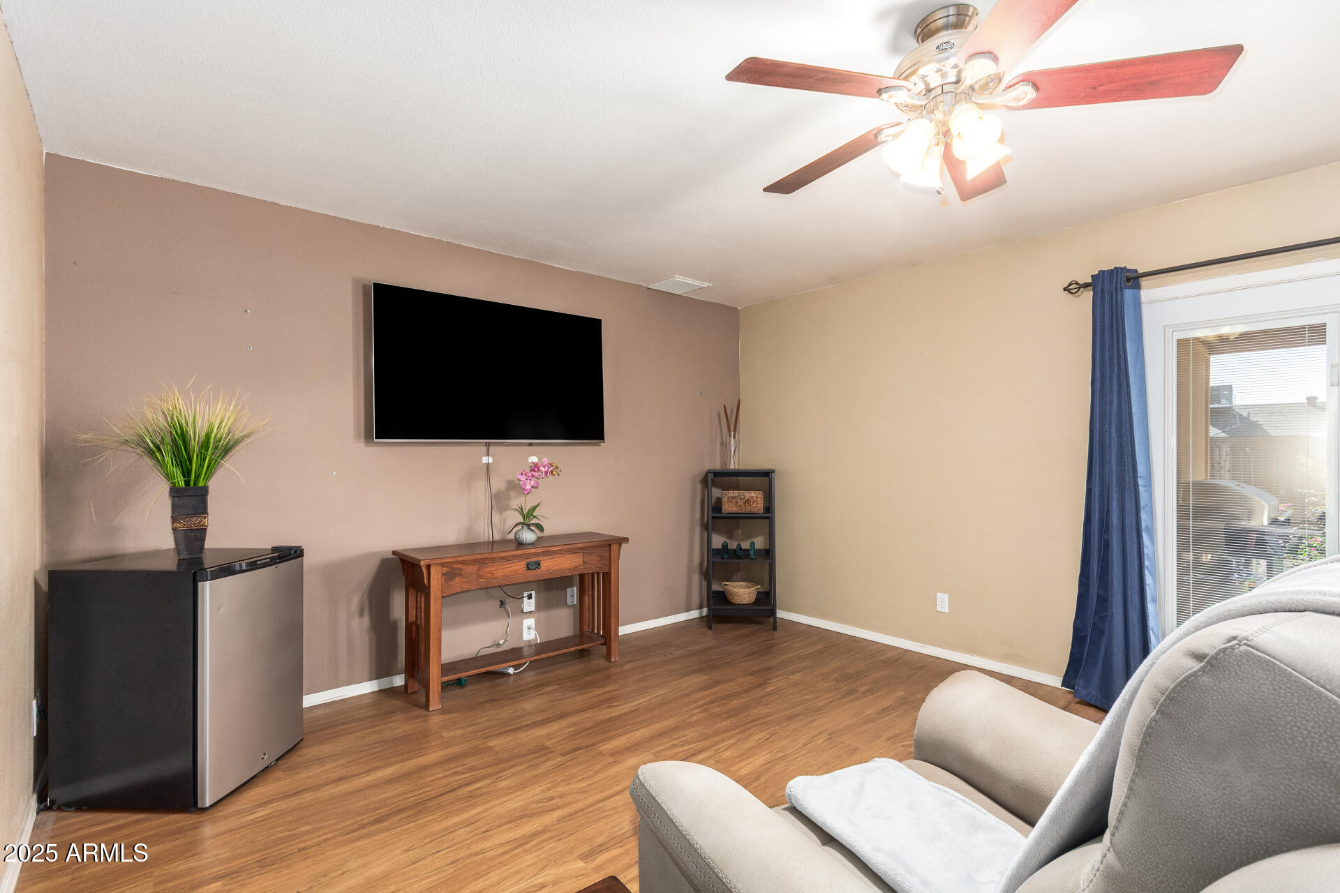 3341 West Pershing Avenue Phoenix, AZ 85029 - Photo 12 of 36 a living room with furniture and a flat screen tv