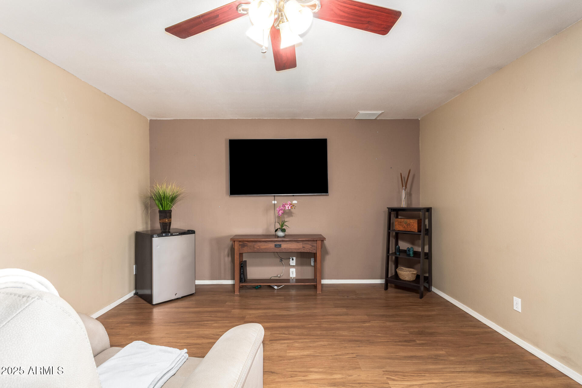 3341 West Pershing Avenue Phoenix, AZ 85029 - Photo 13 of 36 a living room with furniture and a flat screen tv