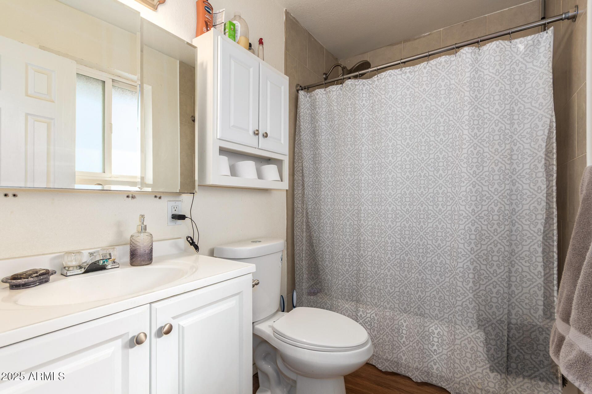 3341 West Pershing Avenue Phoenix, AZ 85029 - Photo 20 of 36 a bathroom with a sink a toilet and shower