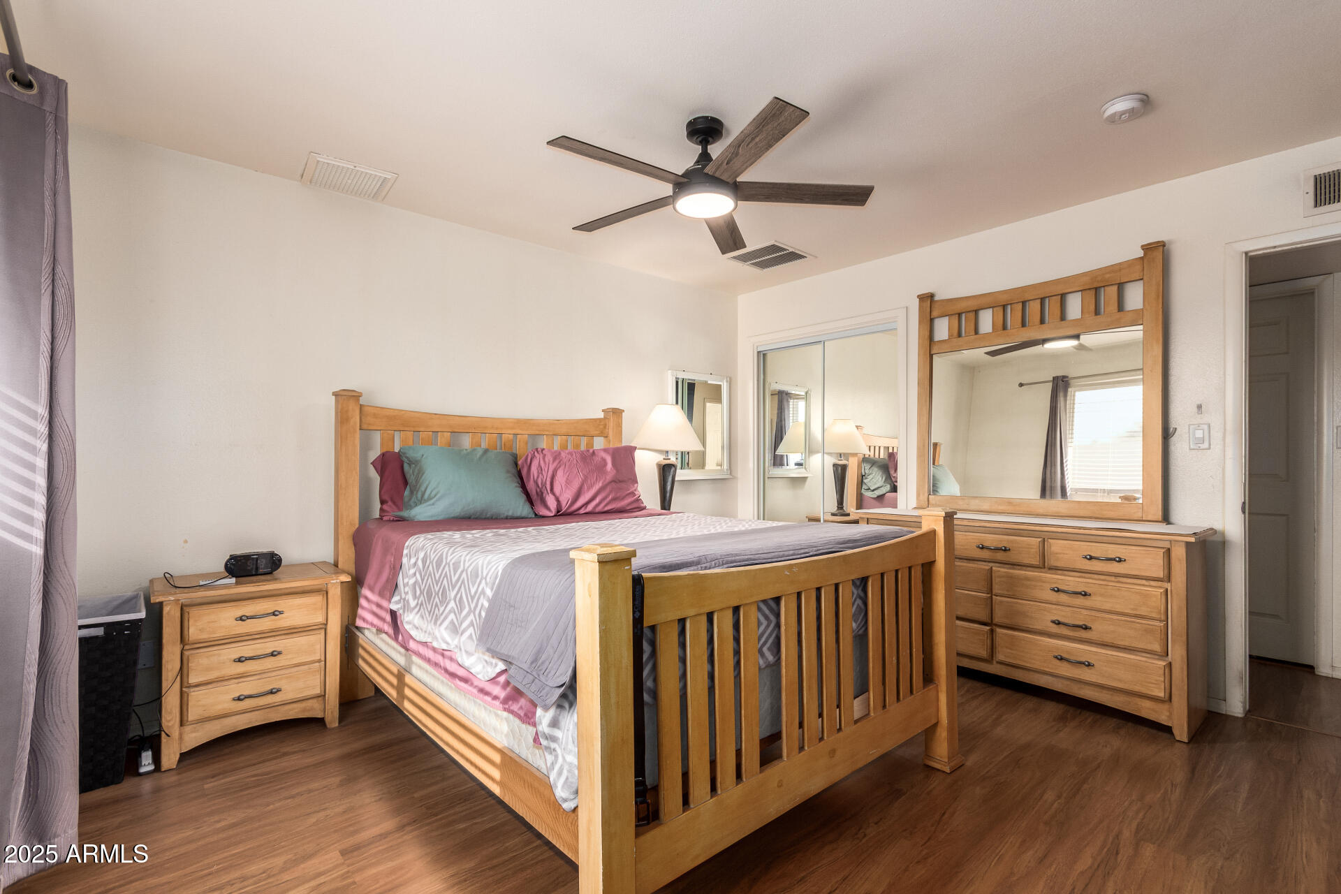 3341 West Pershing Avenue Phoenix, AZ 85029 - Photo 21 of 36 a bedroom with a bed and a chandelier