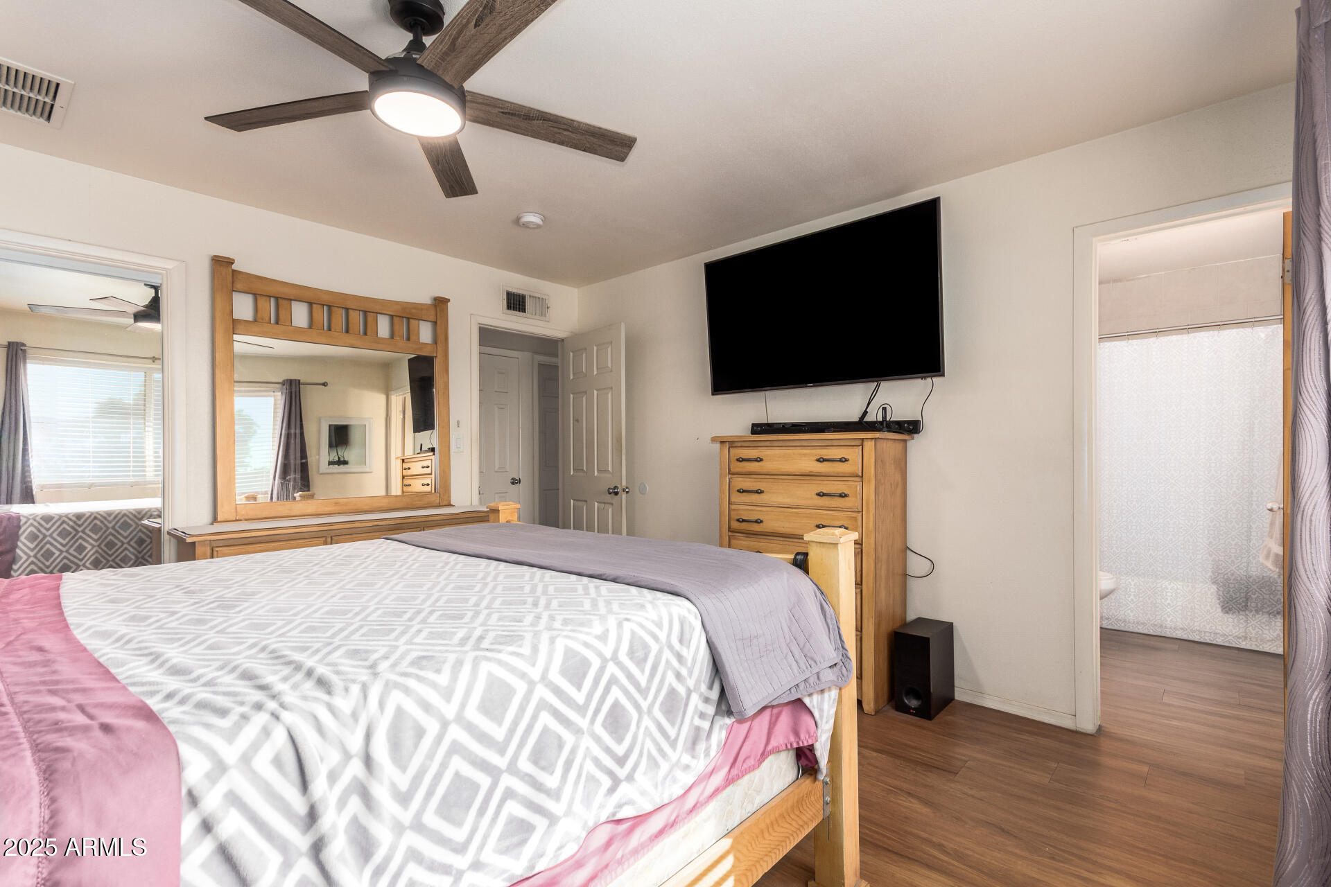 3341 West Pershing Avenue Phoenix, AZ 85029 - Photo 22 of 36 a bedroom with a bed and a flat screen tv