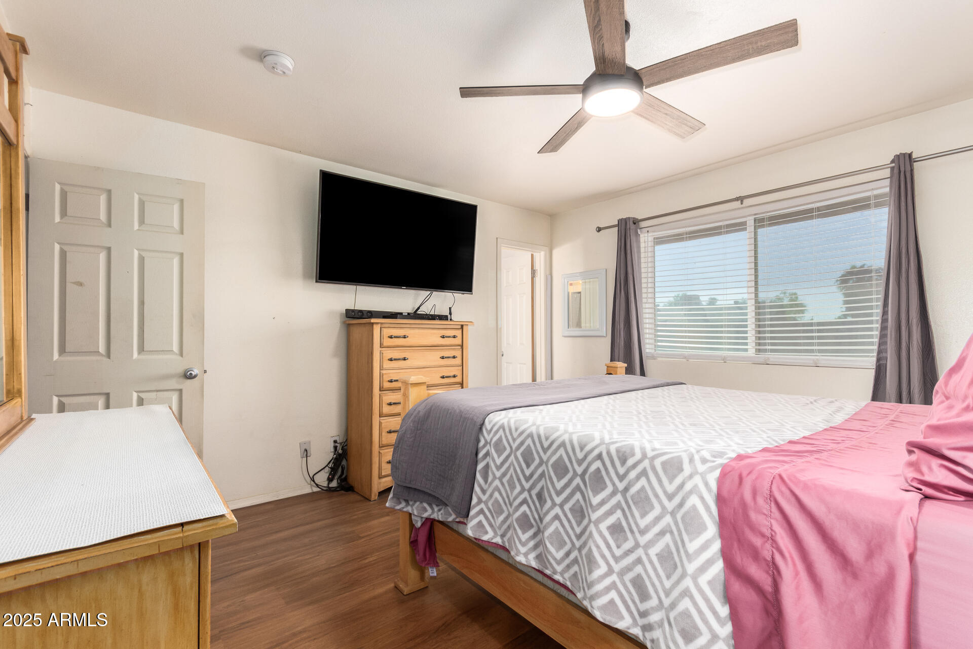 3341 West Pershing Avenue Phoenix, AZ 85029 - Photo 24 of 36 a bedroom with a bed a window and a television