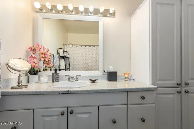 a bathroom with a sink and a mirror