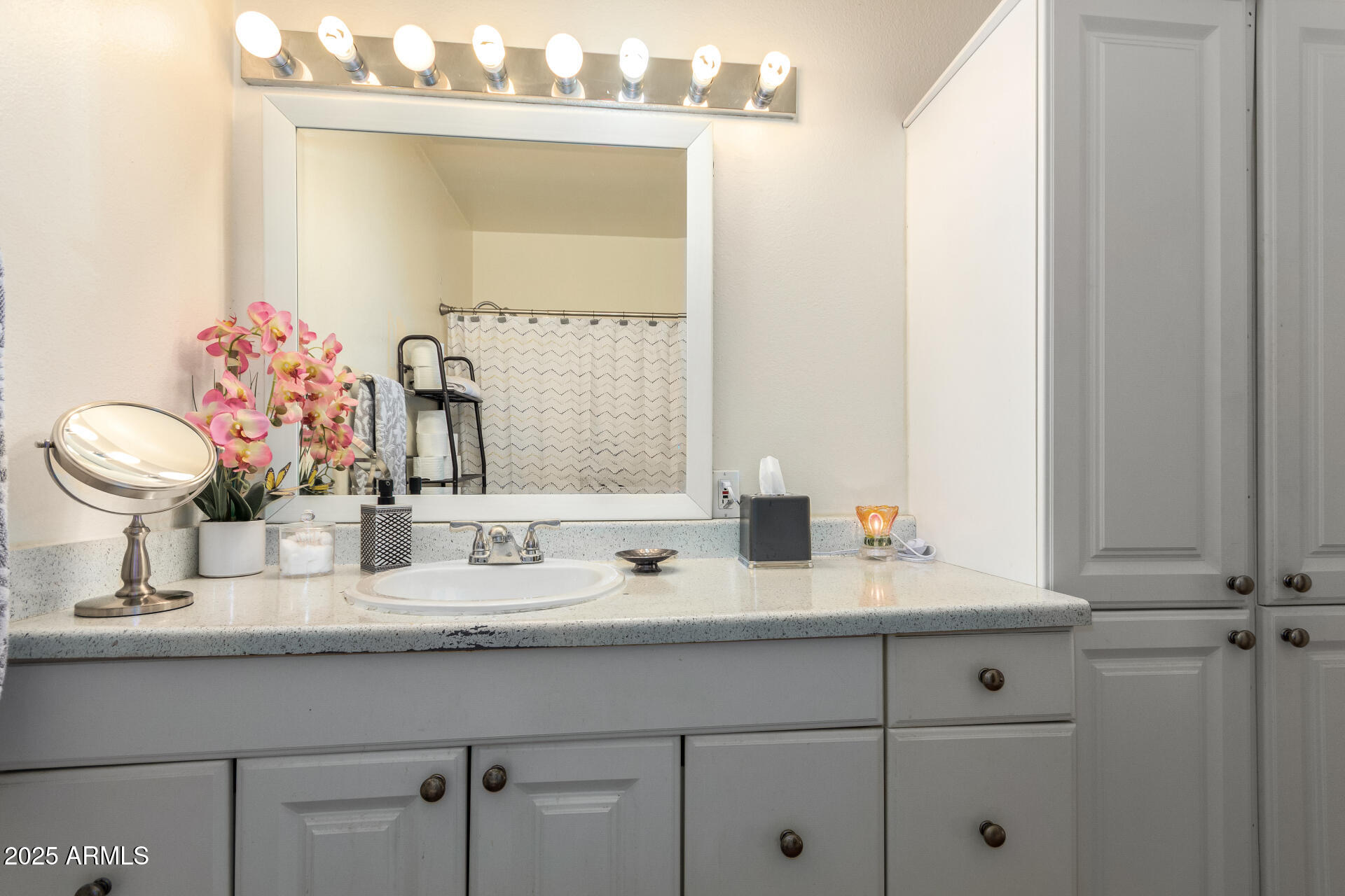 3341 West Pershing Avenue Phoenix, AZ 85029 - Photo 26 of 36 a bathroom with a sink and a mirror