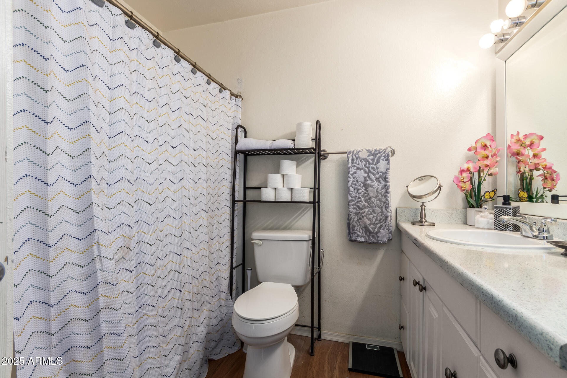 3341 West Pershing Avenue Phoenix, AZ 85029 - Photo 27 of 36 a bathroom with a granite countertop toilet sink and mirror