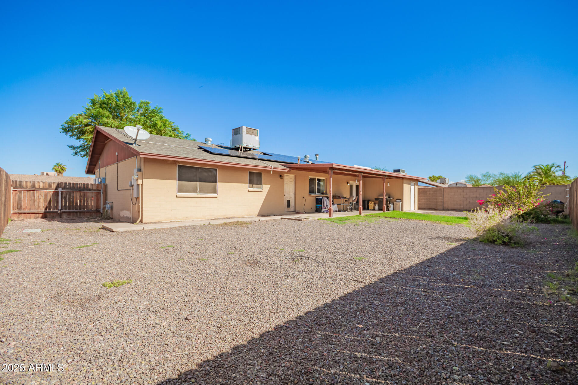 3341 West Pershing Avenue Phoenix, AZ 85029 - Photo 31 of 36 a front view of a house with a yard and garage