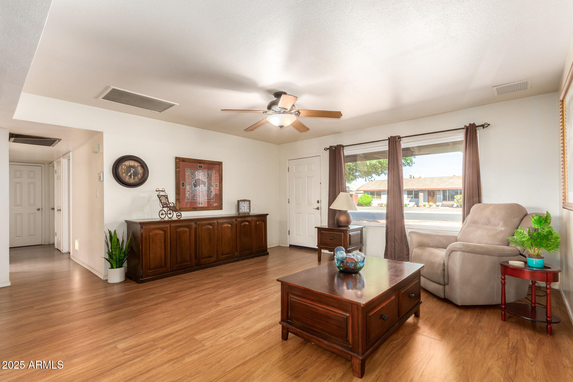 3341 West Pershing Avenue Phoenix, AZ 85029 - Photo 8 of 36 a living room with furniture and a large window