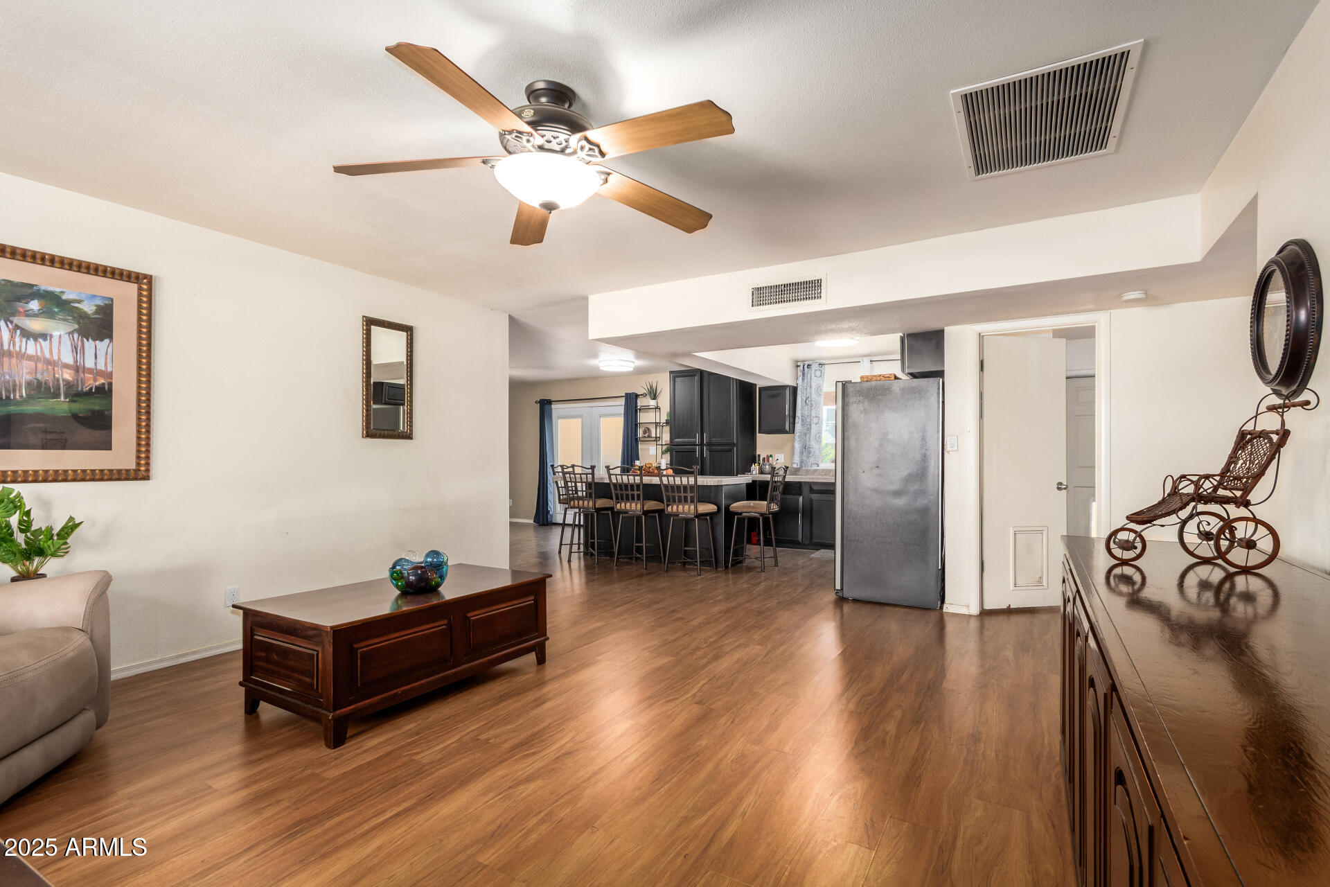 3341 West Pershing Avenue Phoenix, AZ 85029 - Photo 10 of 36 a living room with furniture and kitchen view