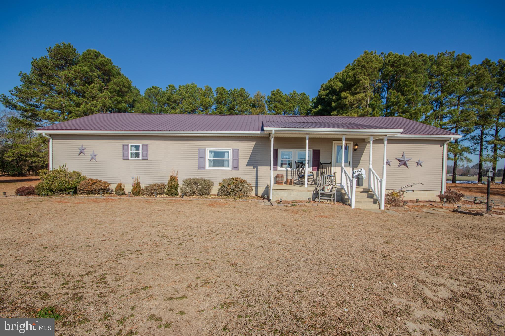 6761 Sharptown Road Laurel, DE 19956 - Photo 1 of 34 a front view of a house with garden