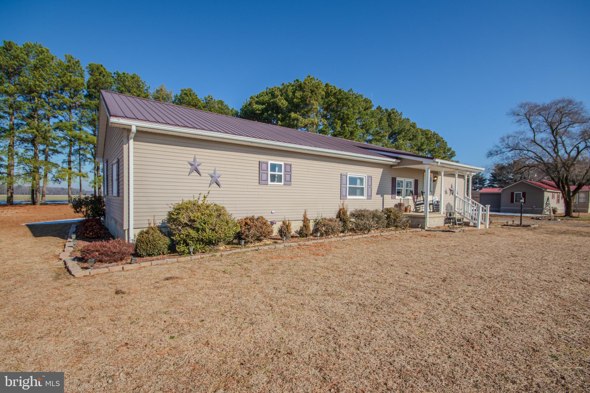 6761 Sharptown Road Laurel, DE 19956 - Photo 2 of 34 a view of a house with a patio
