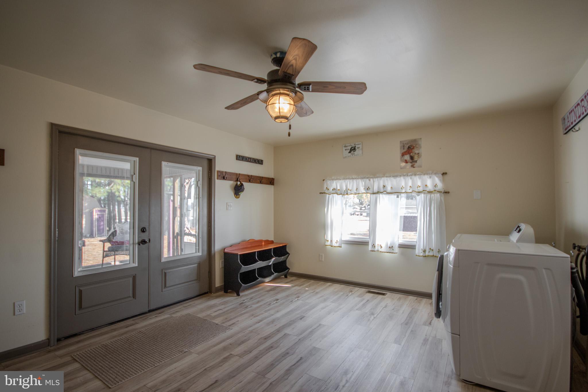 6761 Sharptown Road Laurel, DE 19956 - Photo 23 of 34 a view of a livingroom with a window and wooden floor