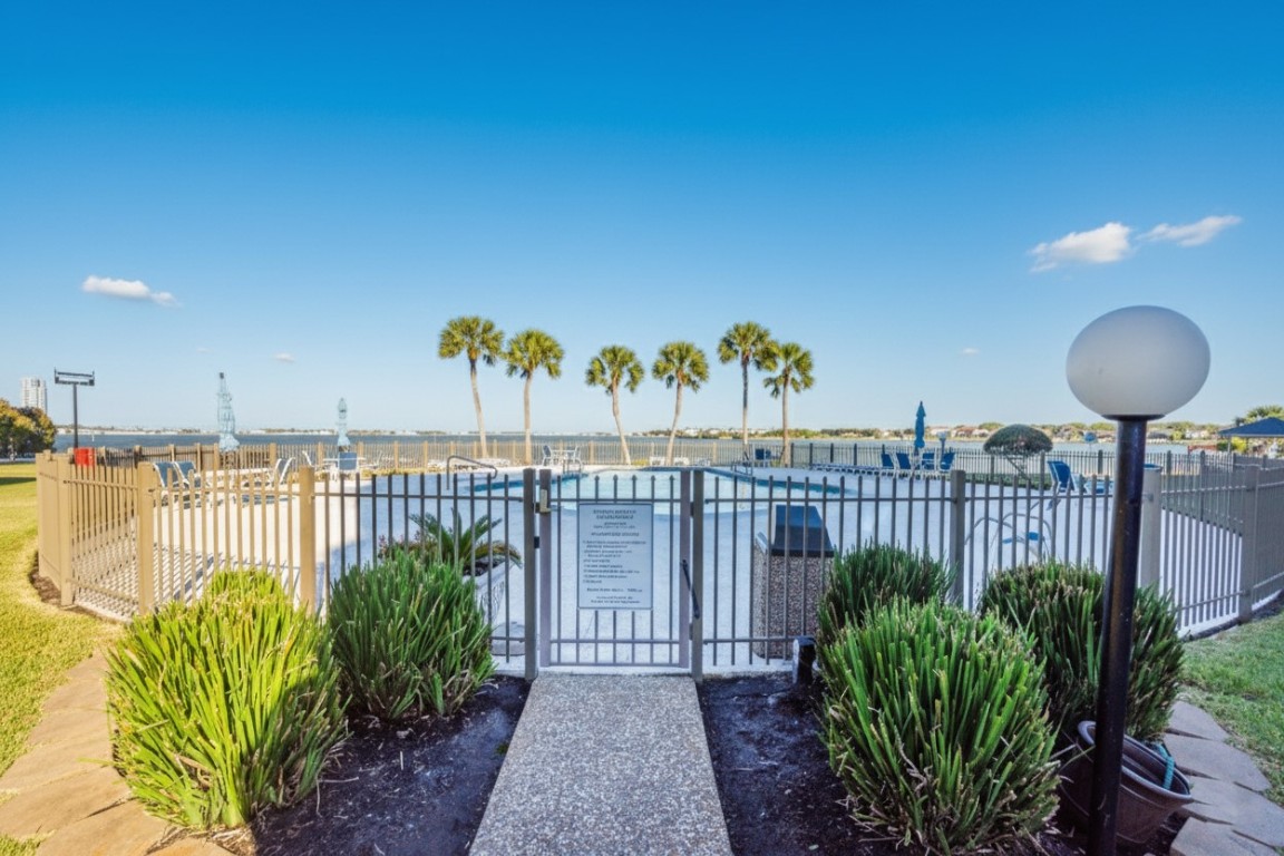 401 Lakeside Lane, Unit 203 Houston, TX 77058 - Photo 6 of 10 a view of a balcony with chairs