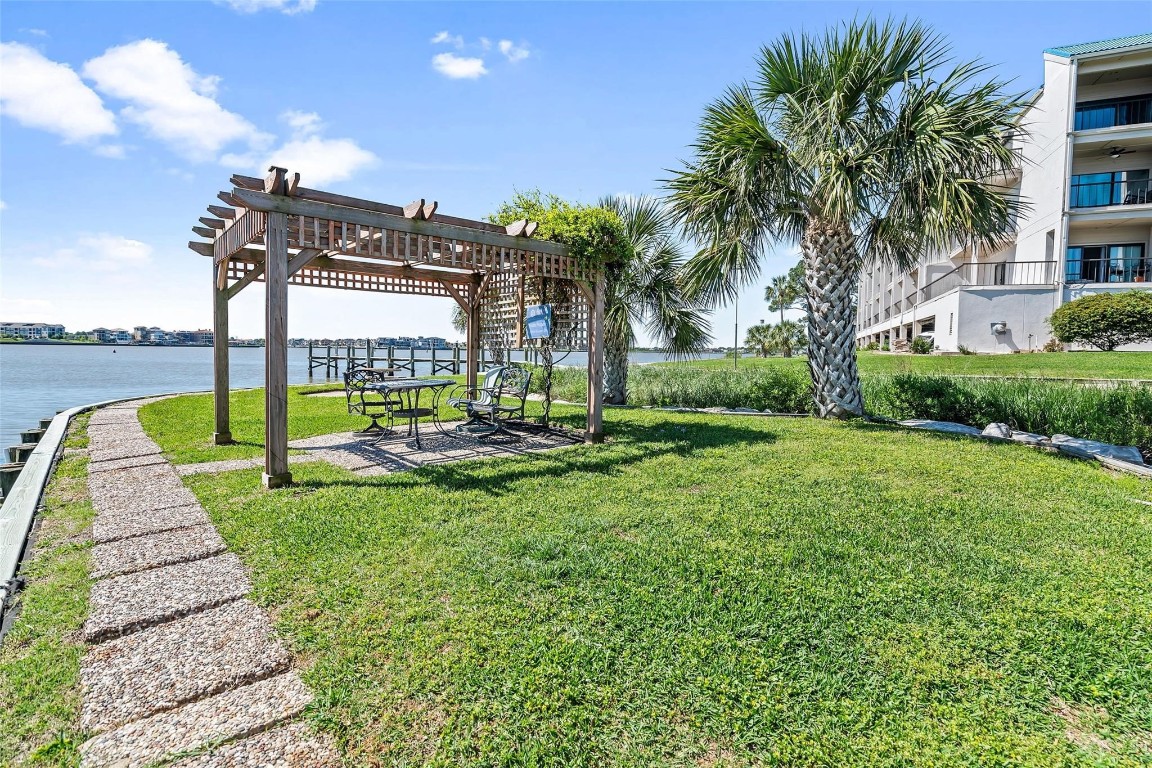 401 Lakeside Lane, Unit 203 Houston, TX 77058 - Photo 8 of 10 a view of a park with swings and slides