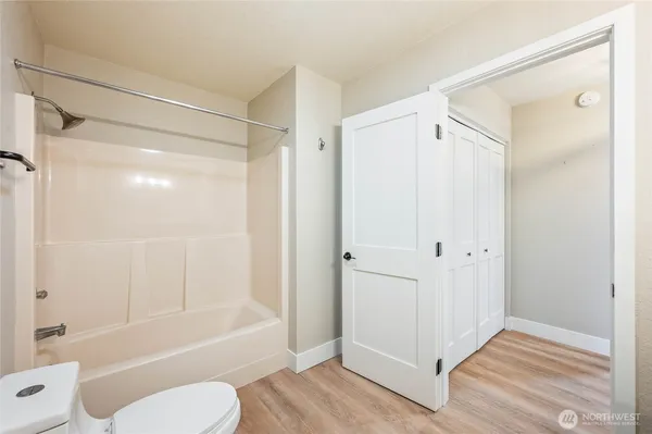 a bathroom that has a glass shower door