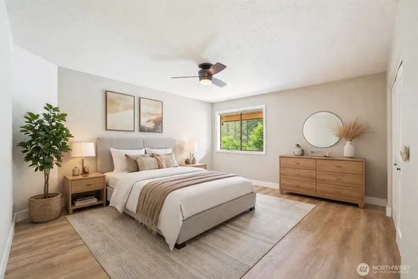 a bedroom with bed and a window