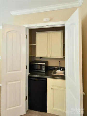 a kitchen with a sink and cabinets
