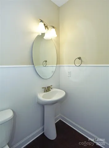 a bathroom with a sink and mirror