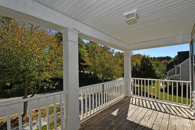 a view of a two chairs in the balcony