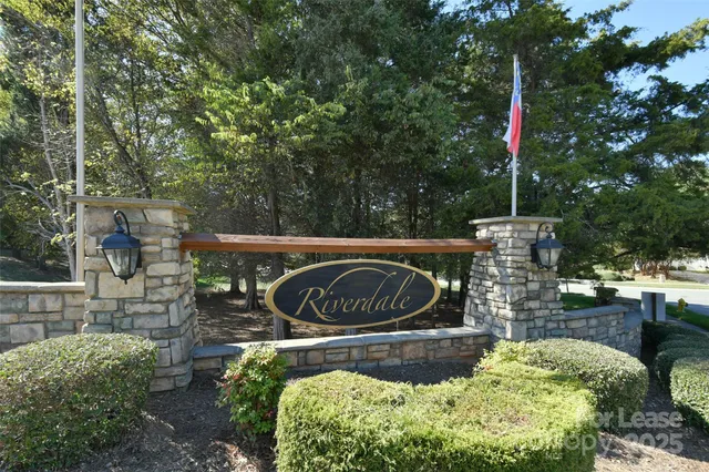 a view of a garden with wooden fence