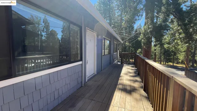 a view of a house with wooden fence