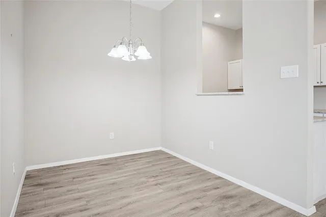 a kitchen with granite countertop a sink and a stove