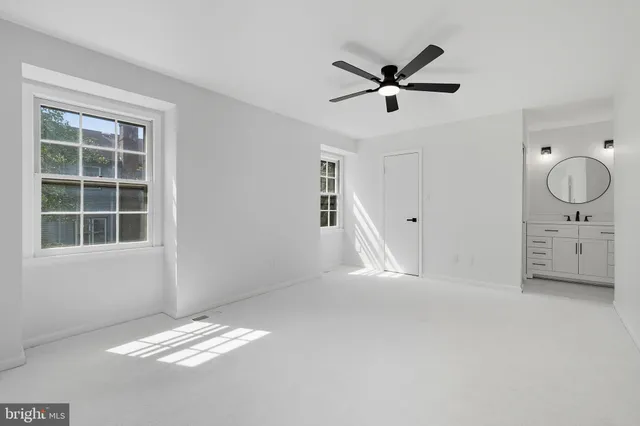 a view of workspace with window and ceiling fan