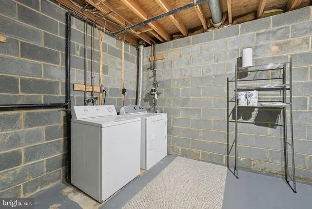 a bathroom with a sink shower and a mirror