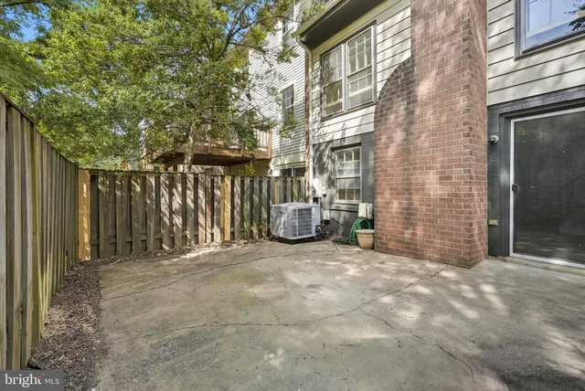a view of a chair and table in the patio