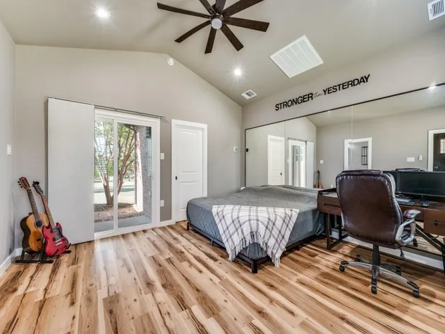 a living room with a bed furniture and a window
