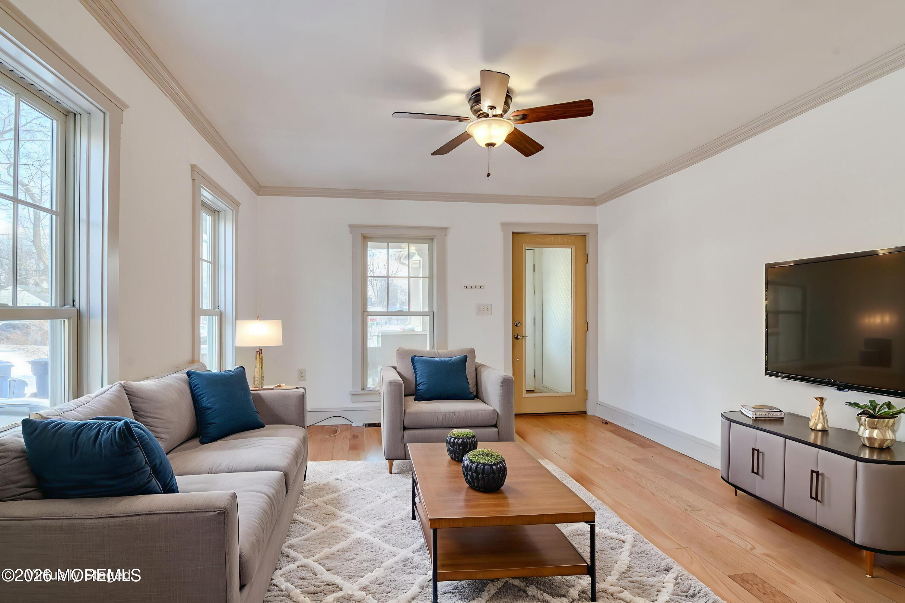 7 Schoolhouse Road Neptune Township, NJ 07753 - Photo 12 of 36 a living room with furniture and a flat screen tv