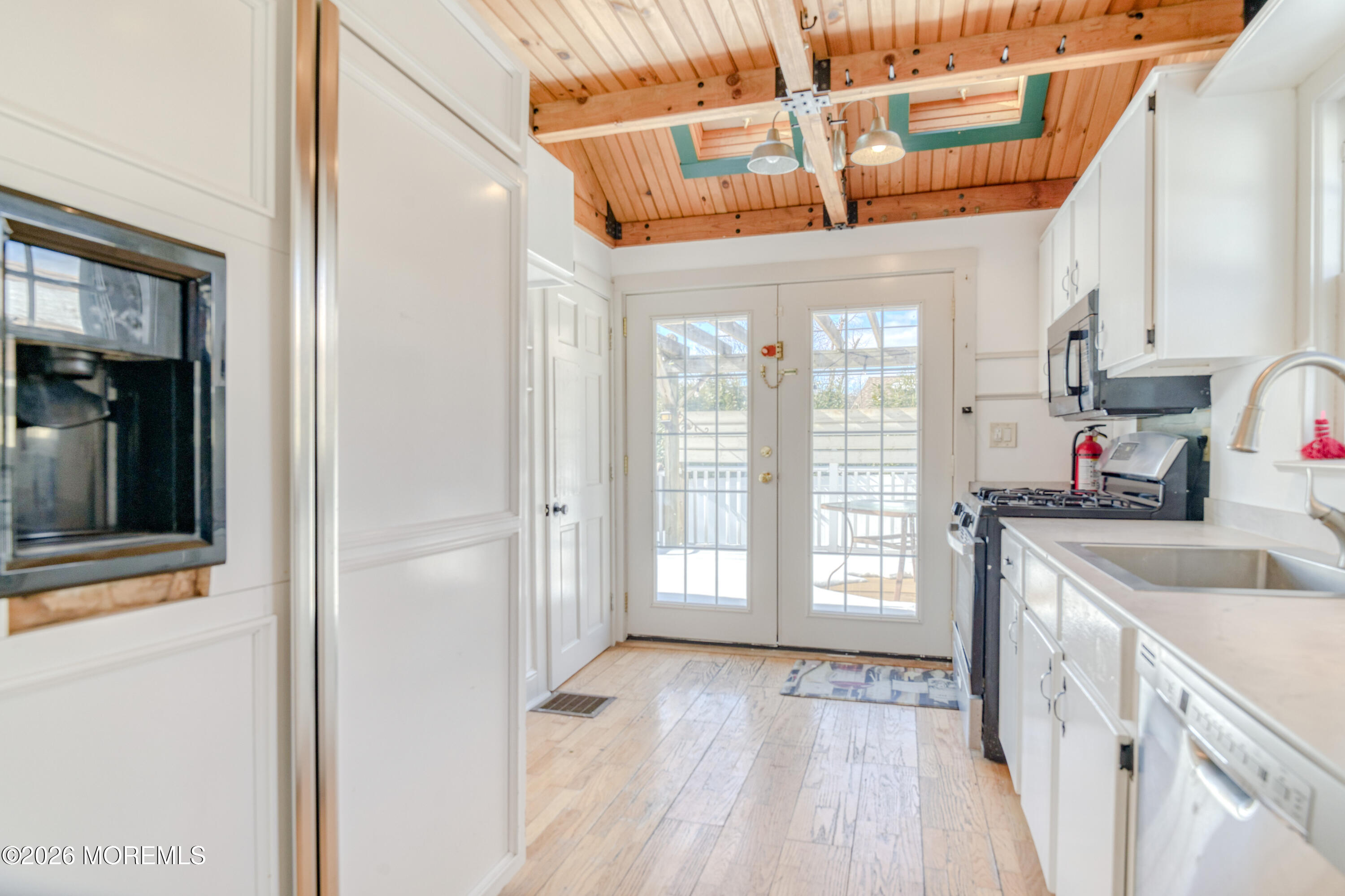 7 Schoolhouse Road Neptune Township, NJ 07753 - Photo 13 of 36 a view of a kitchen with a sink and wooden floor