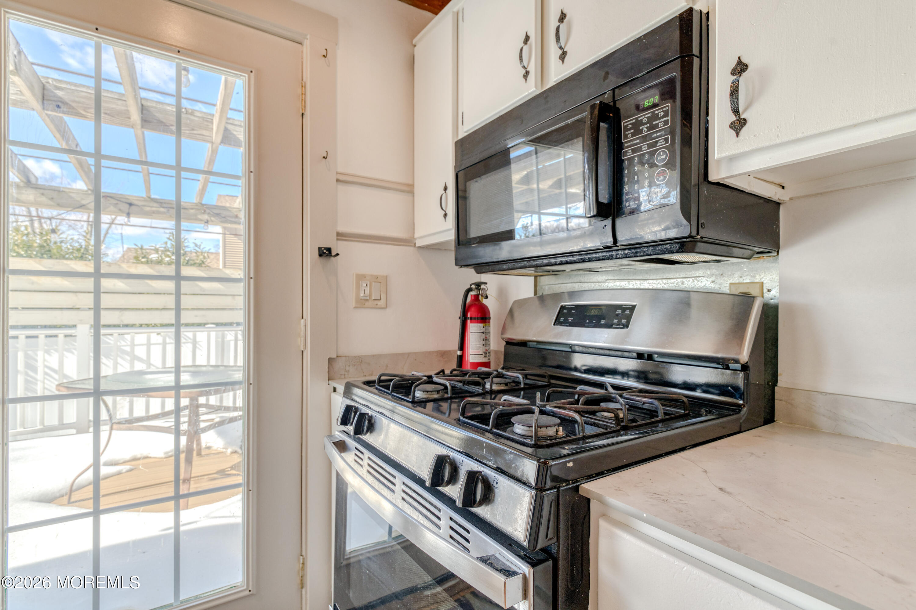 7 Schoolhouse Road Neptune Township, NJ 07753 - Photo 15 of 36 a stove top oven sitting inside of a kitchen