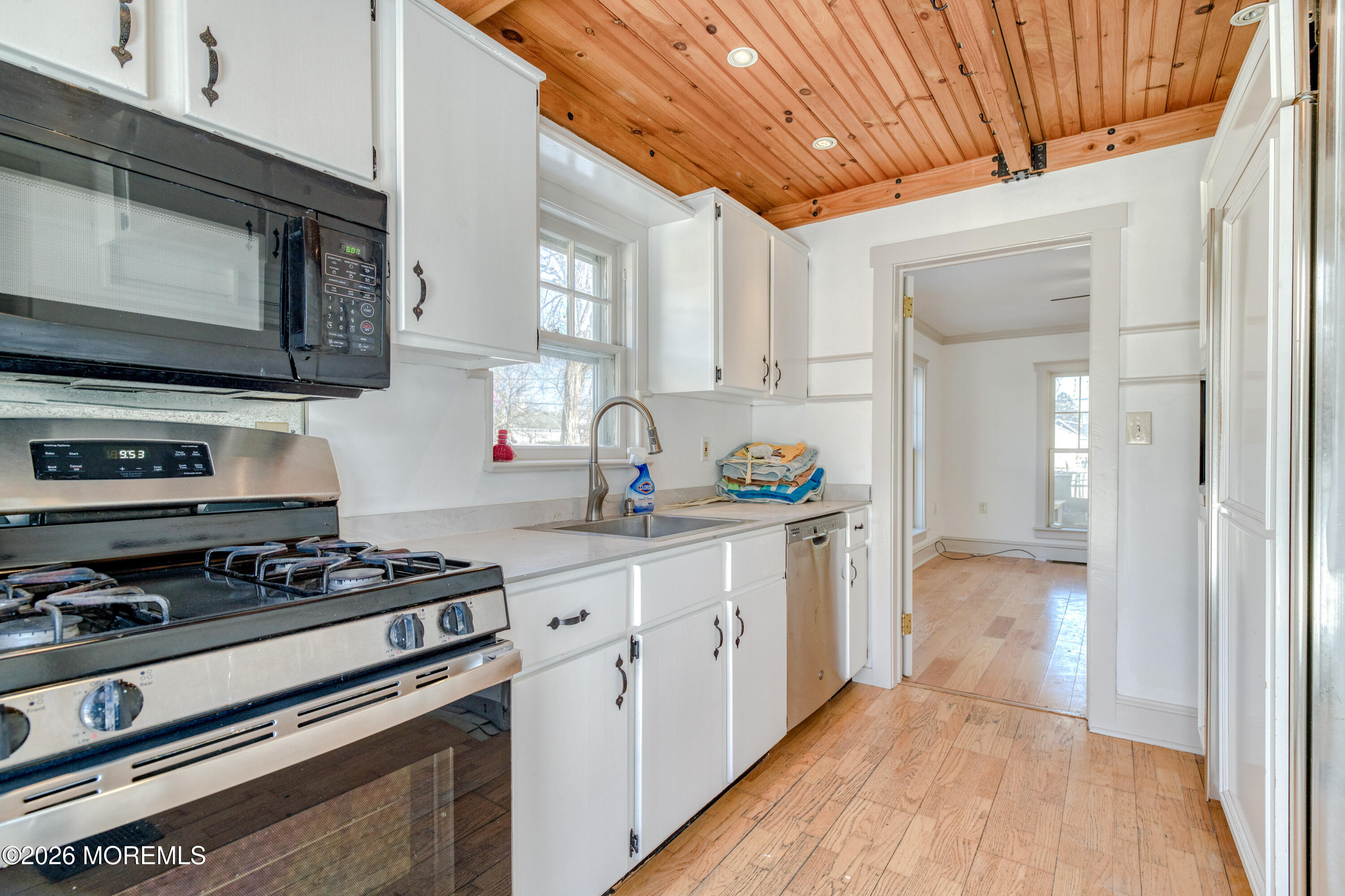 7 Schoolhouse Road Neptune Township, NJ 07753 - Photo 16 of 36 a kitchen with stainless steel appliances a stove a sink and a microwave