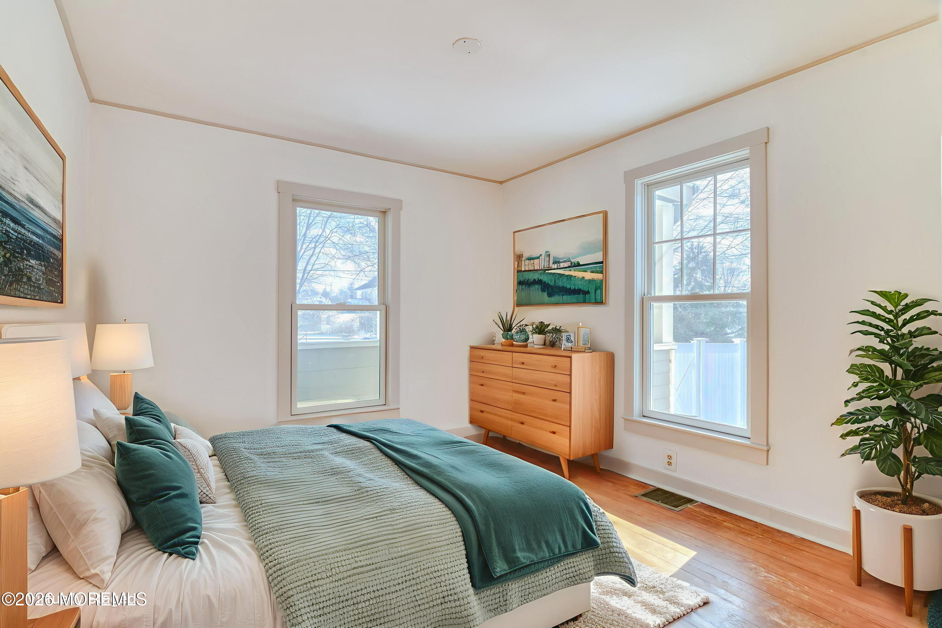 7 Schoolhouse Road Neptune Township, NJ 07753 - Photo 18 of 36 a bedroom with a balcony a bed and a window