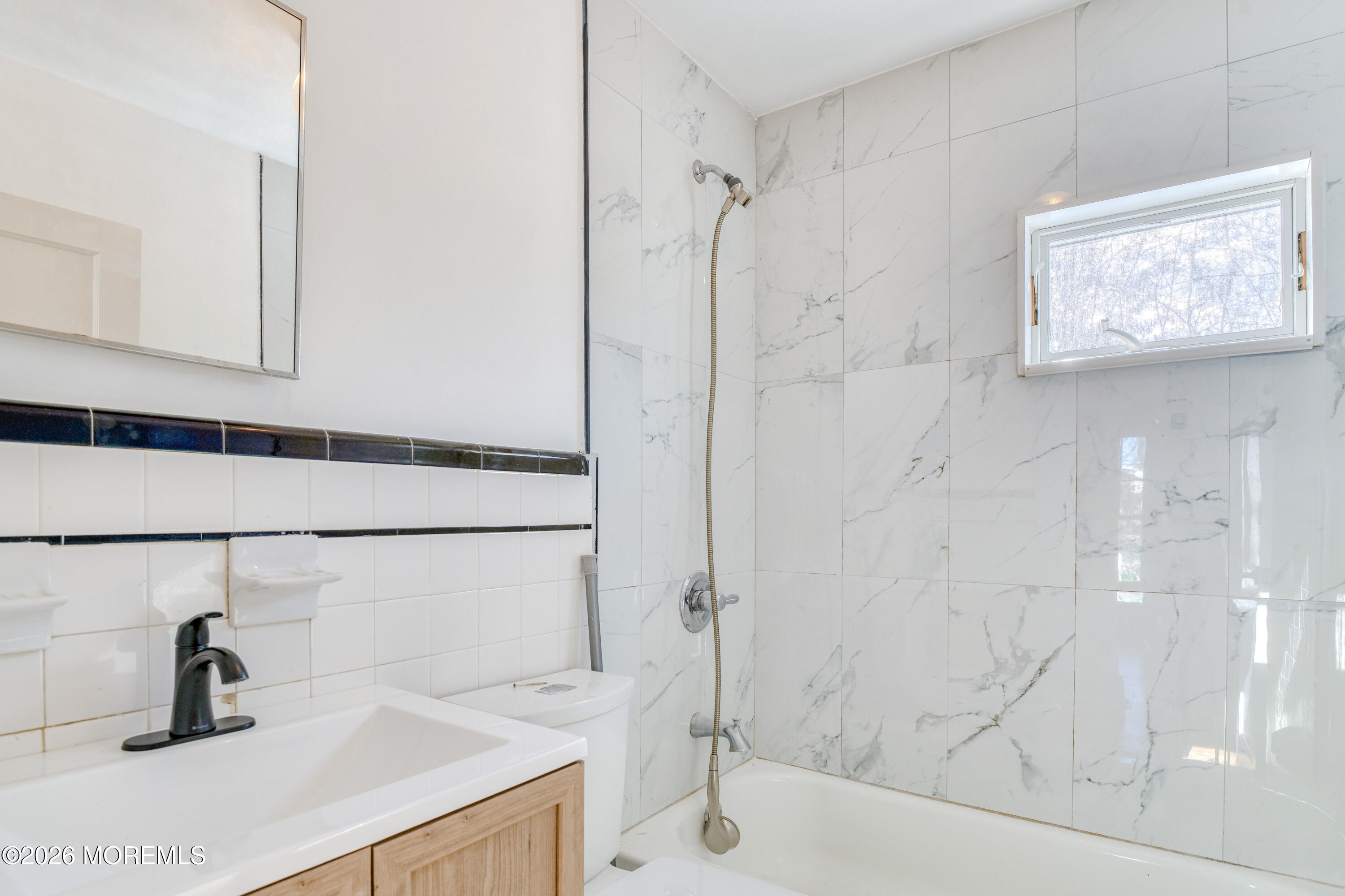 7 Schoolhouse Road Neptune Township, NJ 07753 - Photo 21 of 36 a bathroom with a sink and a bathtub