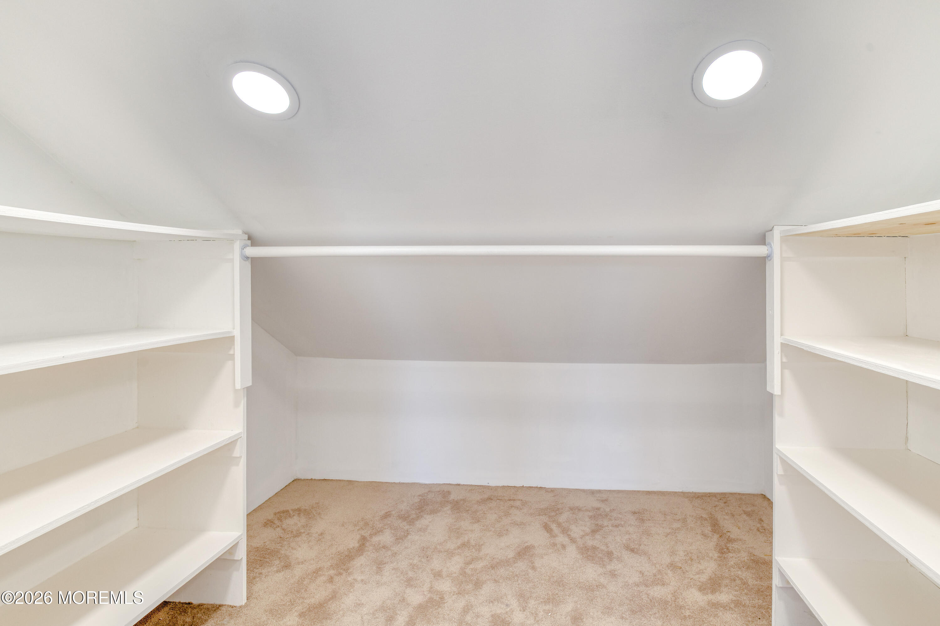 7 Schoolhouse Road Neptune Township, NJ 07753 - Photo 24 of 36 a view of an empty room with empty racks