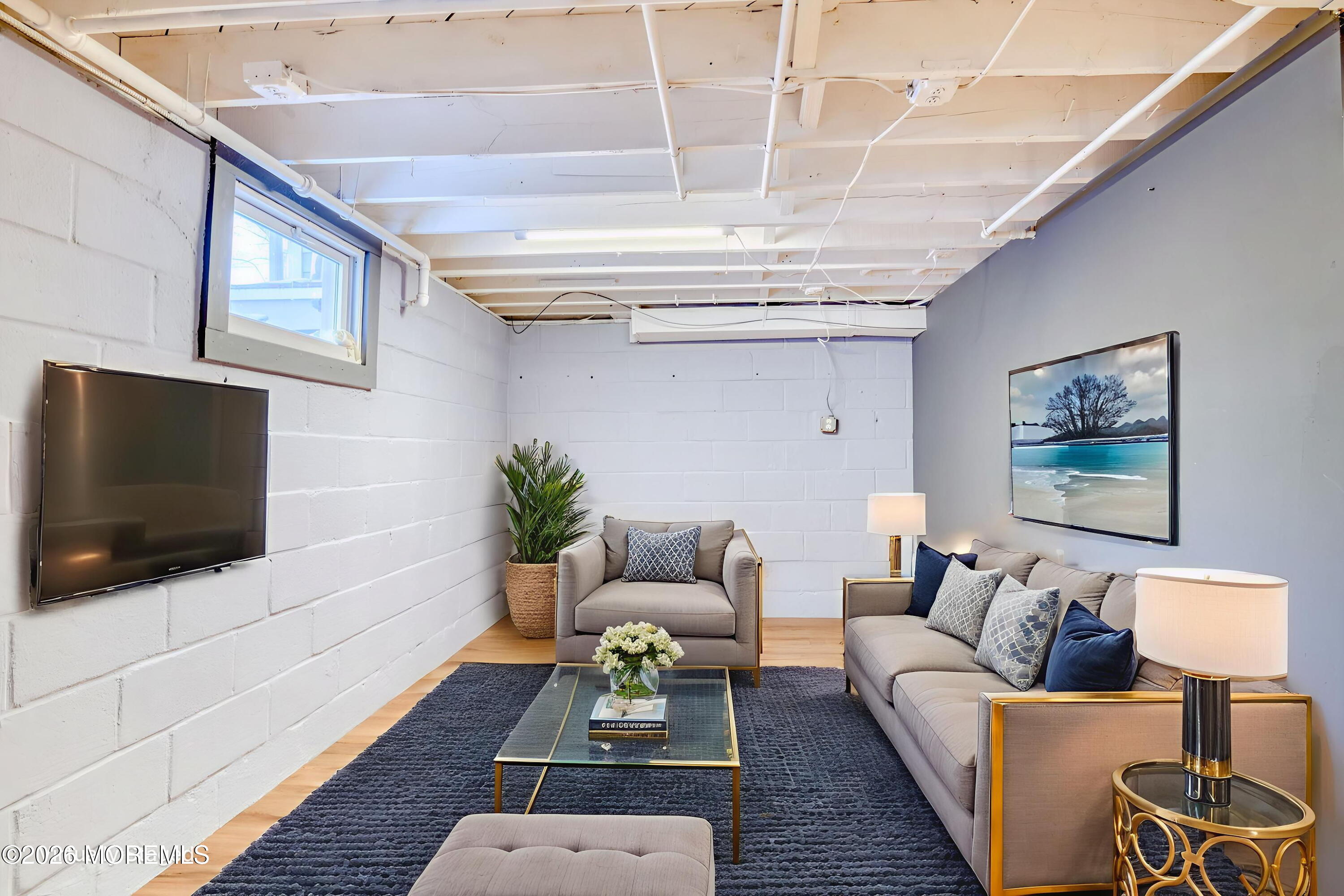 7 Schoolhouse Road Neptune Township, NJ 07753 - Photo 28 of 36 a living room with furniture and a flat screen tv