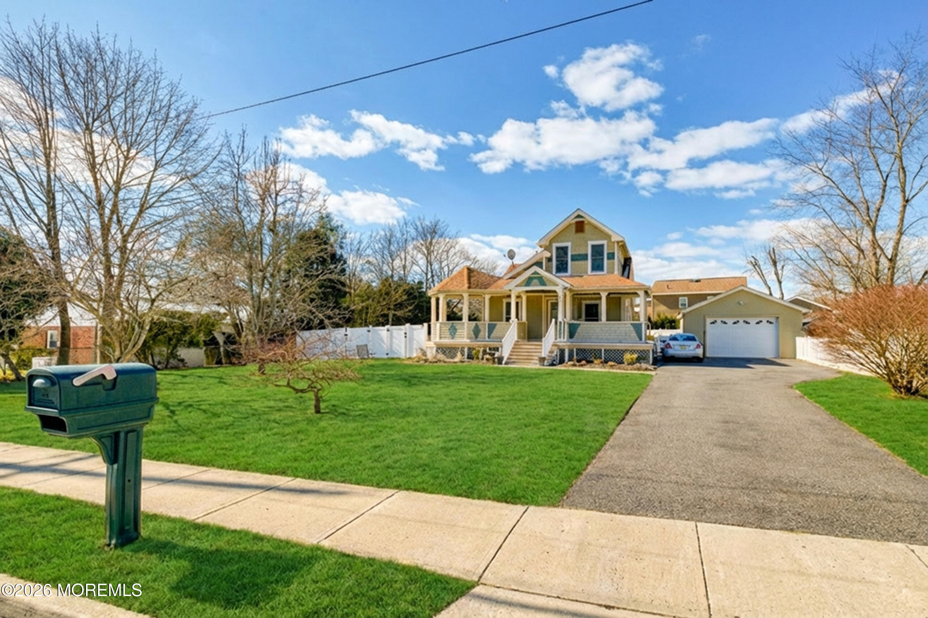 7 Schoolhouse Road Neptune Township, NJ 07753 - Photo 34 of 36 a front view of a house with a yard