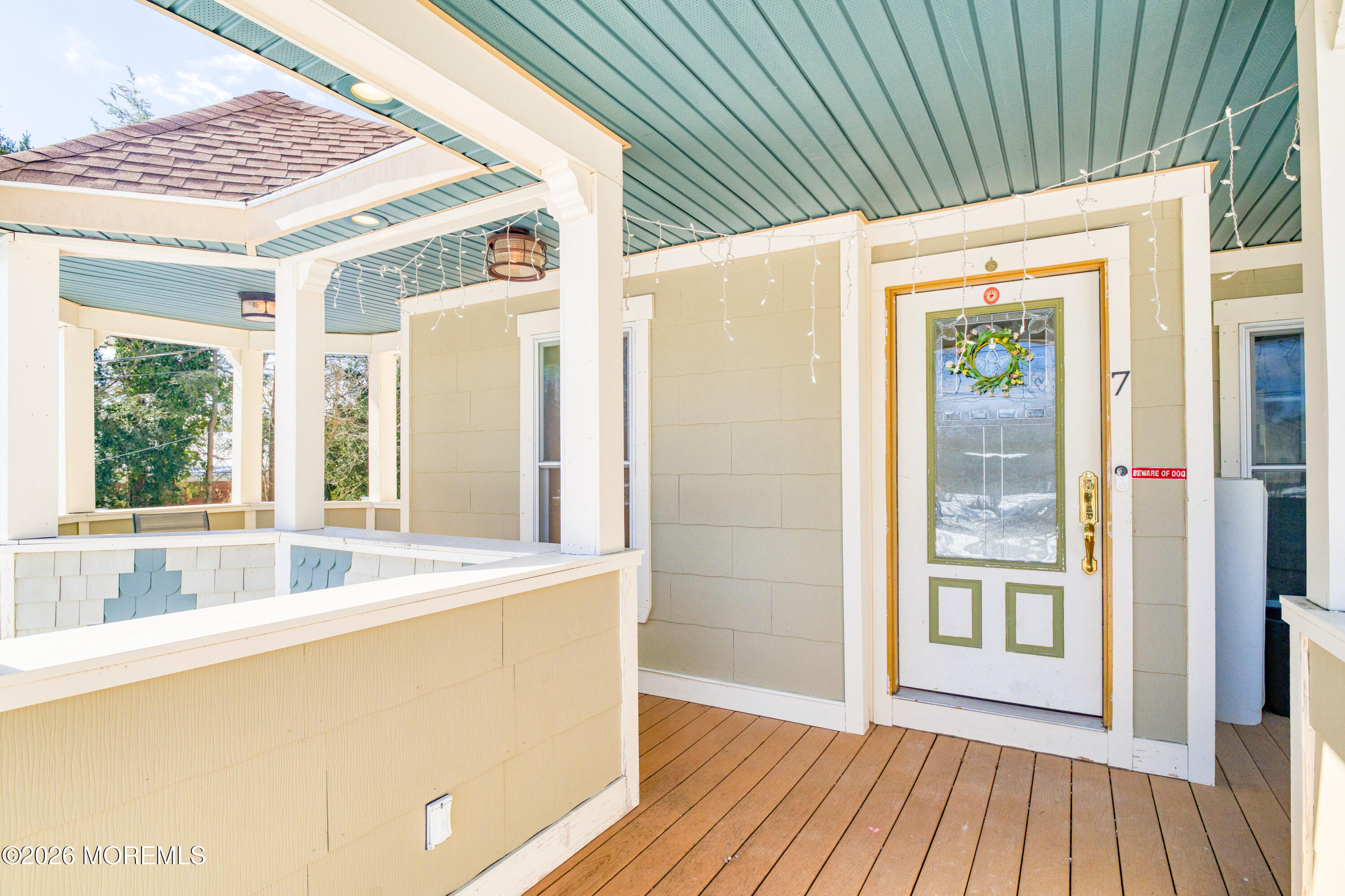 7 Schoolhouse Road Neptune Township, NJ 07753 - Photo 6 of 36 a view of a kitchen from a big room with wooden floor and windows