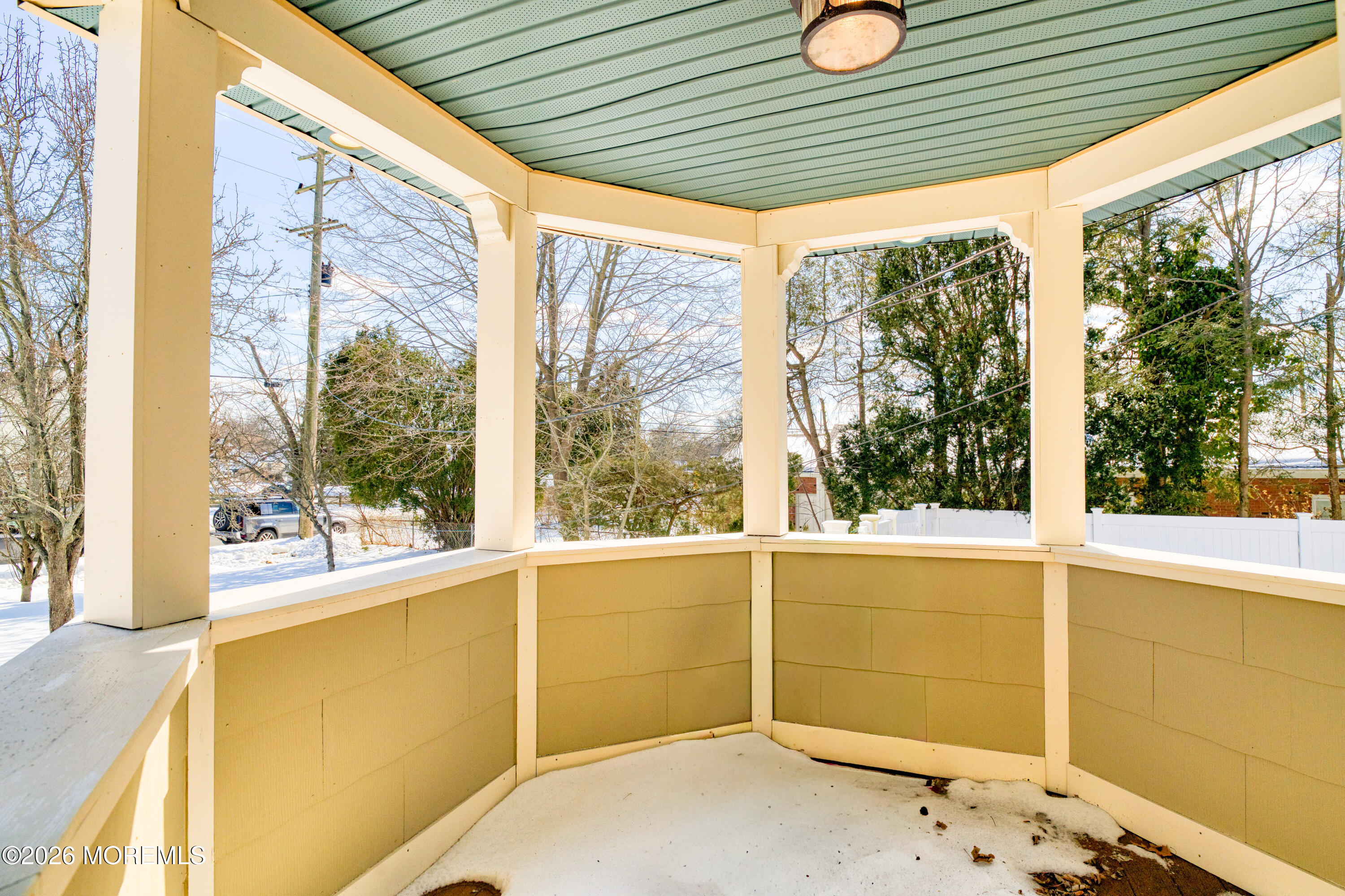 7 Schoolhouse Road Neptune Township, NJ 07753 - Photo 7 of 36 a view of a porch with wooden floor and a porch