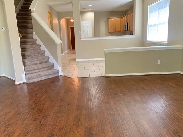 wooden floor in a room with a window and wooden floor